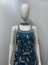 Detail of the layered hem on a teal embroidered sharara kurta set