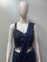 Close view of the crystal beadwork and hanging accents on a midnight blue blouse