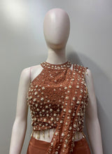 Full-length view of a copper pearl embellished drape set