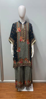 Sleeve and hem detail on a nomad print kaftan and trouser set