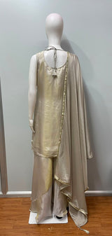 Detail of the flared hem on an ivory and gold sharara suit set