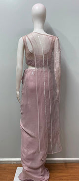 Detail of the sheer net cape on a lilac sequin draped skirt set