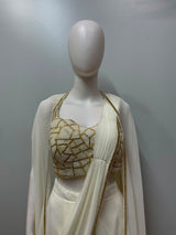 Close view of the gold handwork on an ivory drape saree blouse