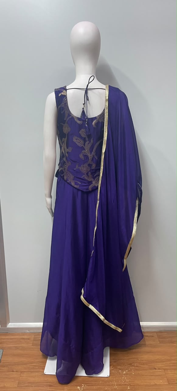 Detail of the neckline on a royal purple gold embroidered kurta