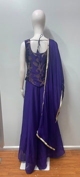 Detail of the neckline on a royal purple gold embroidered kurta