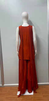 Close view of the gold embroidery on a burnt orange kurta and palazzo