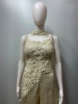 Close view of the pearl work on an ivory cape and palazzo set