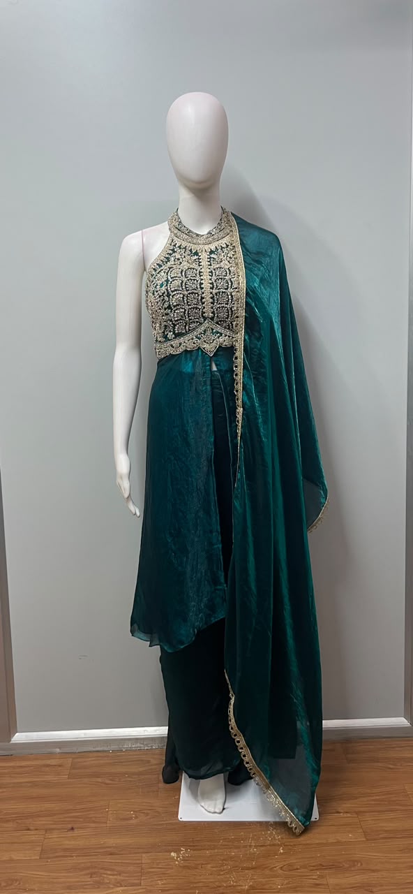 Close view of the gold embroidery on an emerald anarkali kurta
