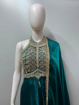 Full-length view of an emerald and gold flared anarkali on the model