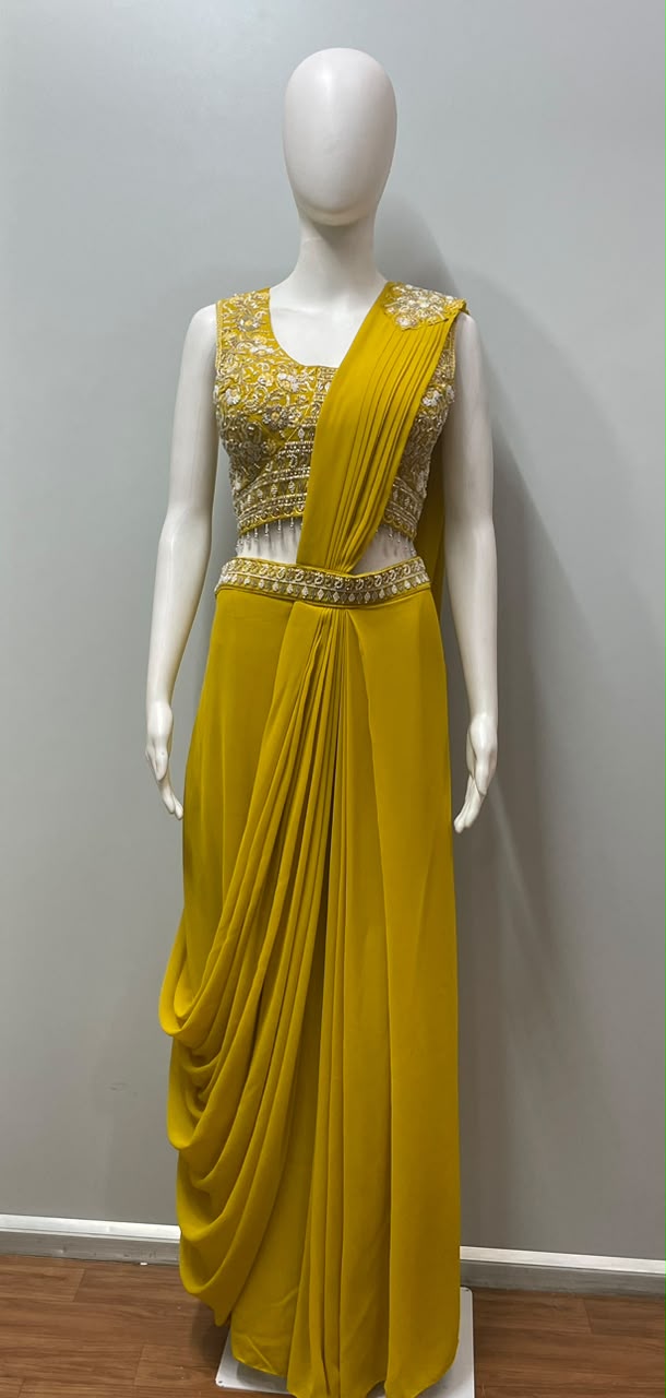 Close view of the drape and shimmer on a golden luxe saree set