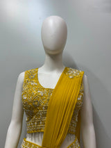 Full-length view of a golden luxe draped saree set on the model