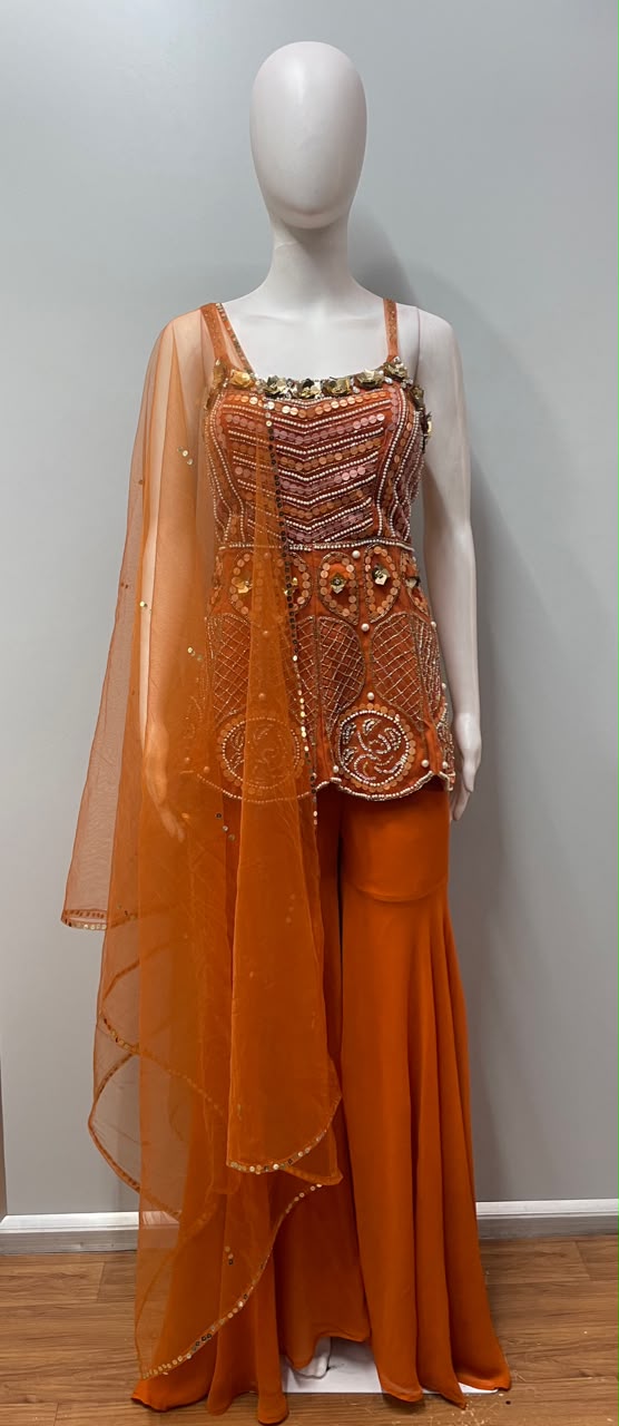 Tangerine peplum palazzo set styled for a festive celebration
