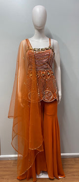 Tangerine peplum palazzo set styled for a festive celebration