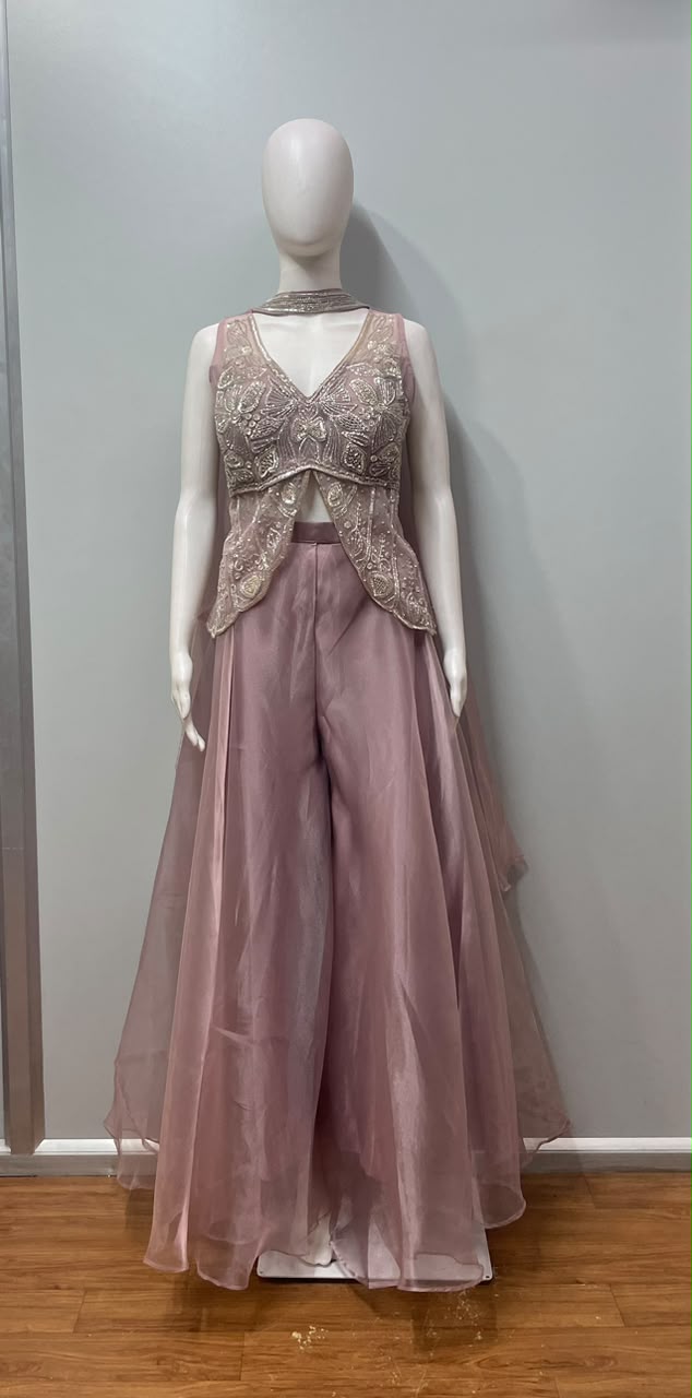 Detail of the neckline on a dusty pink embroidered kurta set