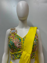 Close view of the floral embroidery on a sunshine yellow palazzo set