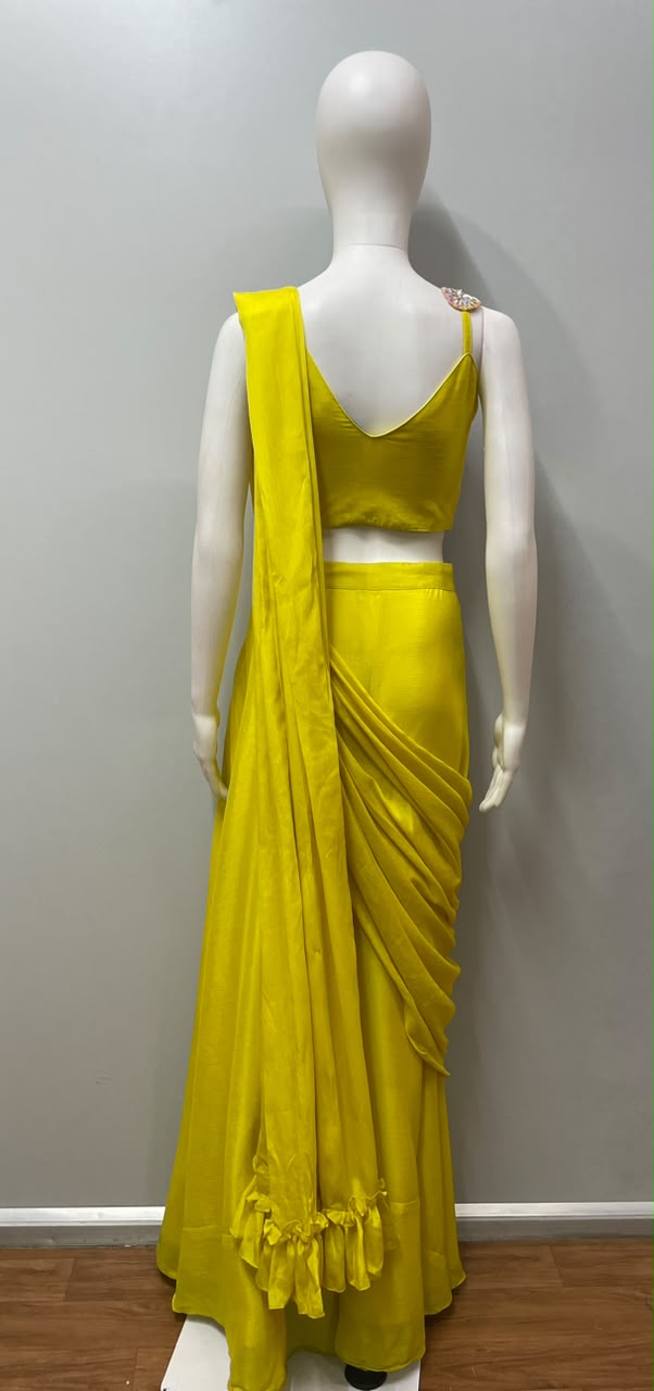 Detail of the drape and hem on a sunshine yellow palazzo set