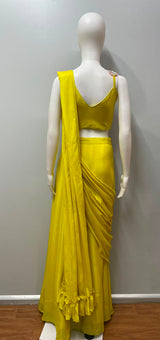 Detail of the drape and hem on a sunshine yellow palazzo set