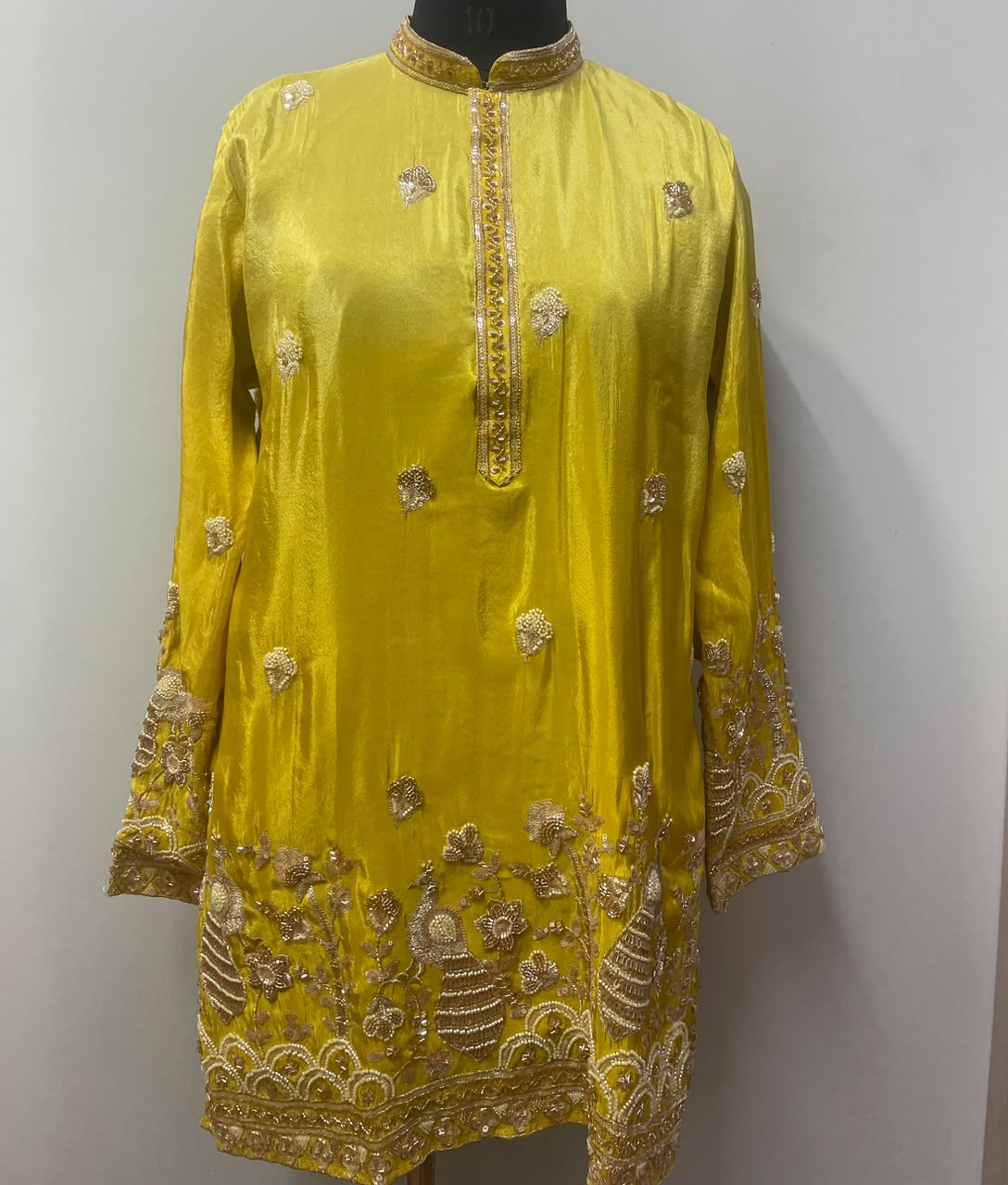 Chartreuse yellow kurta with gold peacock motifs, front view
