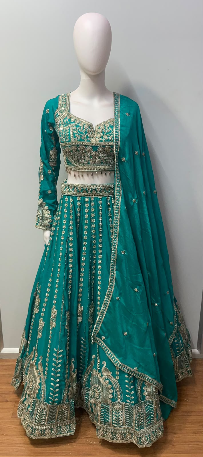 Asymmetric one-sleeve teal blouse with antique gold threadwork and embroidered waist panel