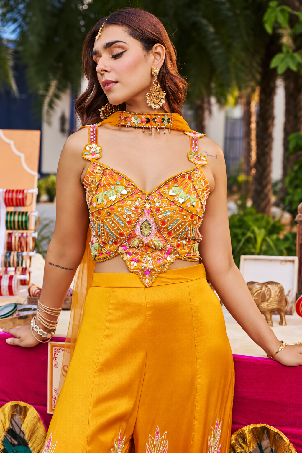 Wide-leg ombre trousers and matching neck scarf on a saffron palazzo set