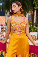 Wide-leg ombre trousers and matching neck scarf on a saffron palazzo set