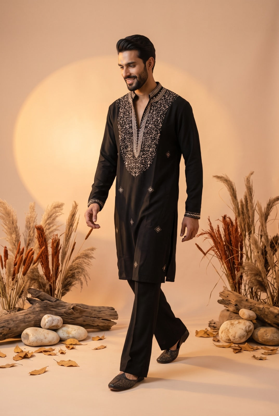 Midnight black men's kurta with antique gold beadwork along the split neckline