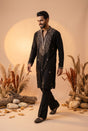 Midnight black men's kurta with antique gold beadwork along the split neckline