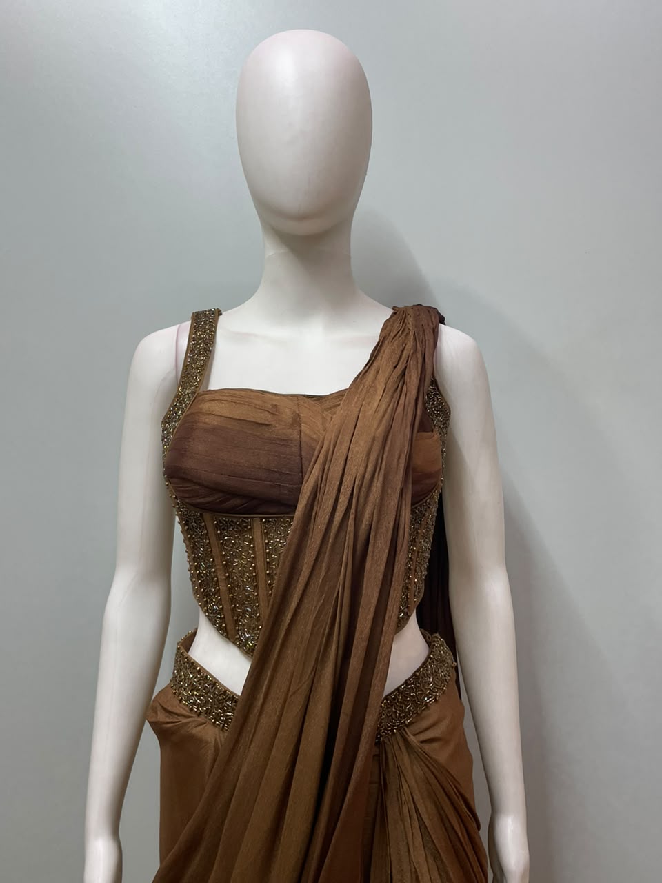 Copper bronze corset saree styled for an evening celebration