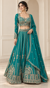 Peacock teal lehenga set with antique gold embroidery and a matching teal dupatta