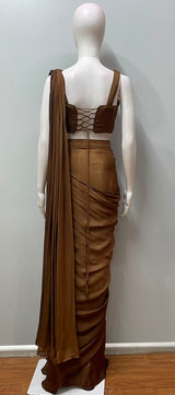 Copper bronze corset saree photographed against a plain backdrop