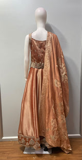 Peach gold jewel corset lehenga set from a third angle