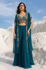 Peacock toned cape with jewel embroidery over palazzo trousers