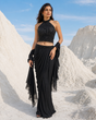 Black draped saree with a crystal embellished halter neck blouse