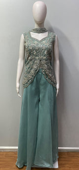Silver floral beadwork across the dusty teal peplum bodice
