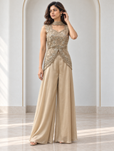 Champagne gold palazzo set with a scalloped split-front peplum top and wide-leg trousers
