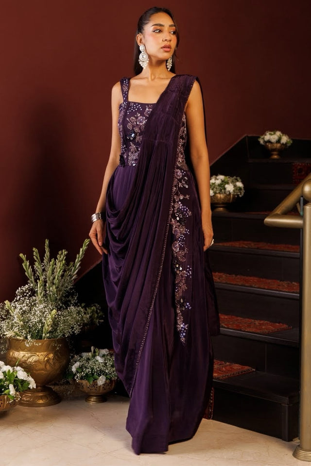 Deep plum draped saree gown with metallic floral embroidery on the bodice