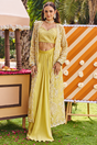 Lime yellow draped skirt set with a chevron beaded blouse and pearl jacket