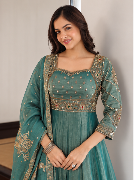 Full flare of the dusty teal floor-length Anarkali