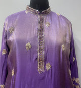 Gold peacock and floral border detail on a royal purple men's kurta