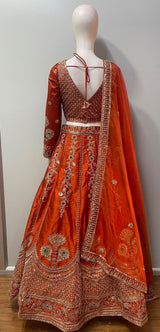 Flared copper orange lehenga skirt with lattice and floral antique gold hem border