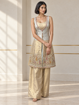 Ice white palazzo set with a layered neckline, jewel detailing and an ornate paisley hem