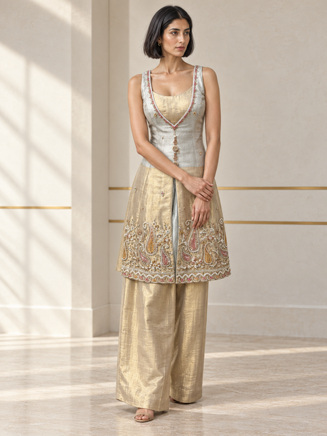 Ice white palazzo set with a layered neckline, jewel detailing and an ornate paisley hem