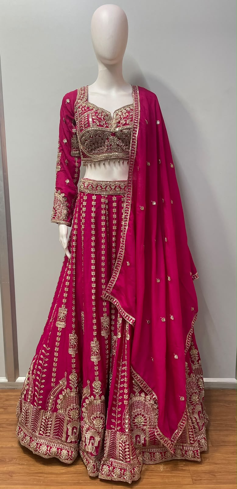 Asymmetric one-sleeve fuchsia blouse with antique gold beadwork and a maroon lower panel