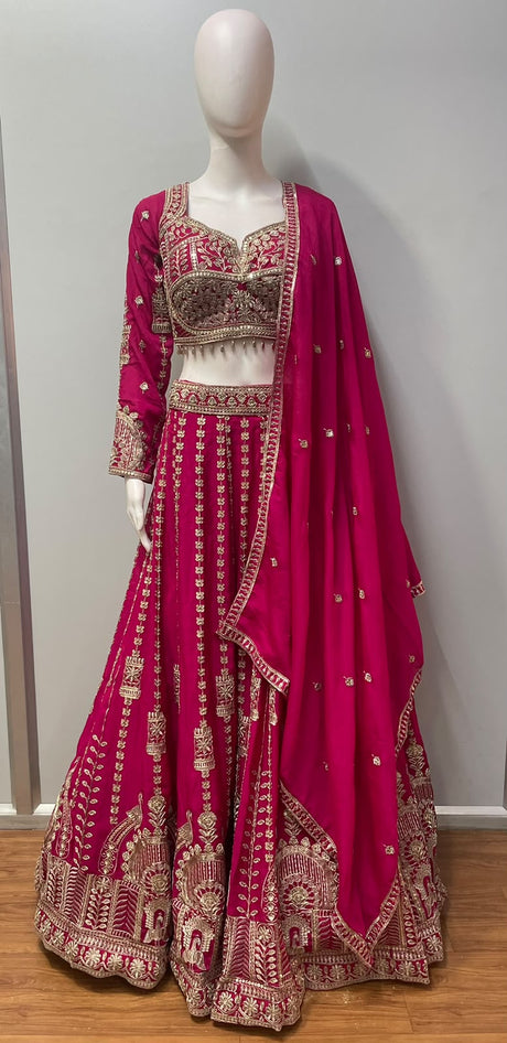 Asymmetric one-sleeve fuchsia blouse with antique gold beadwork and a maroon lower panel