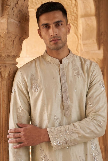 Full-length view of the ivory silver floral kurta and trousers