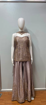 Close view of the gold embroidery on a mauve kurta and palazzo