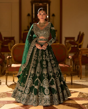 Emerald green embroidered bridal lehenga with a matching blouse