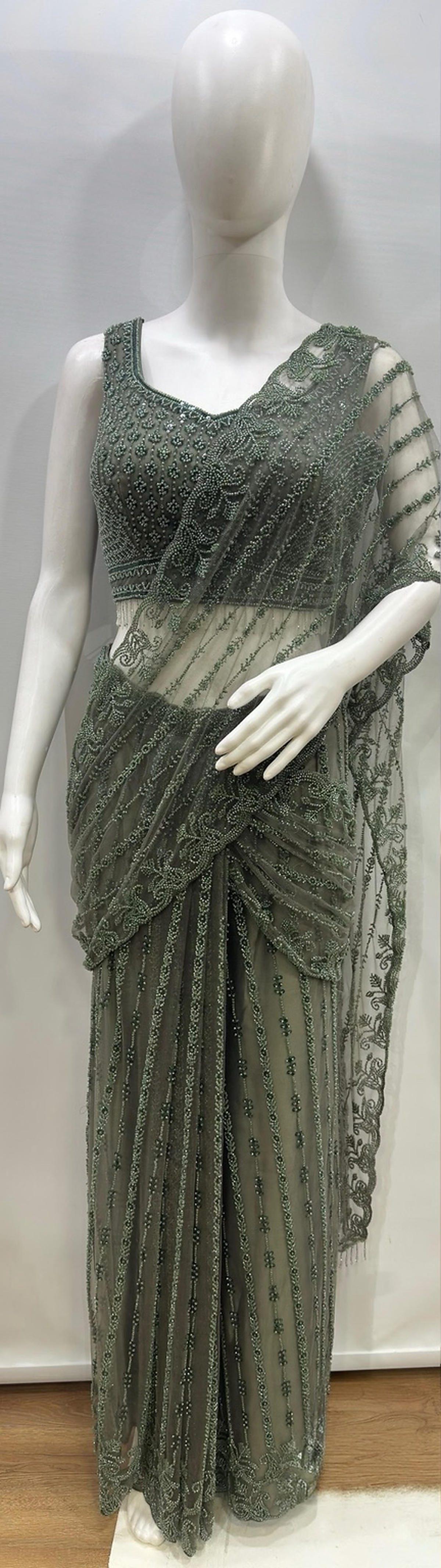 Full-length view of the smoky sage draped saree set with floor-length pleats