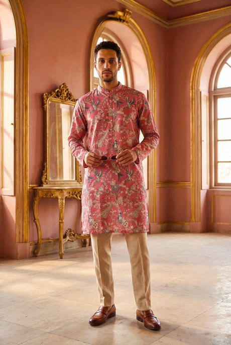 Rose coral men's kurta set with botanical and bird motifs and beige straight-cut trousers