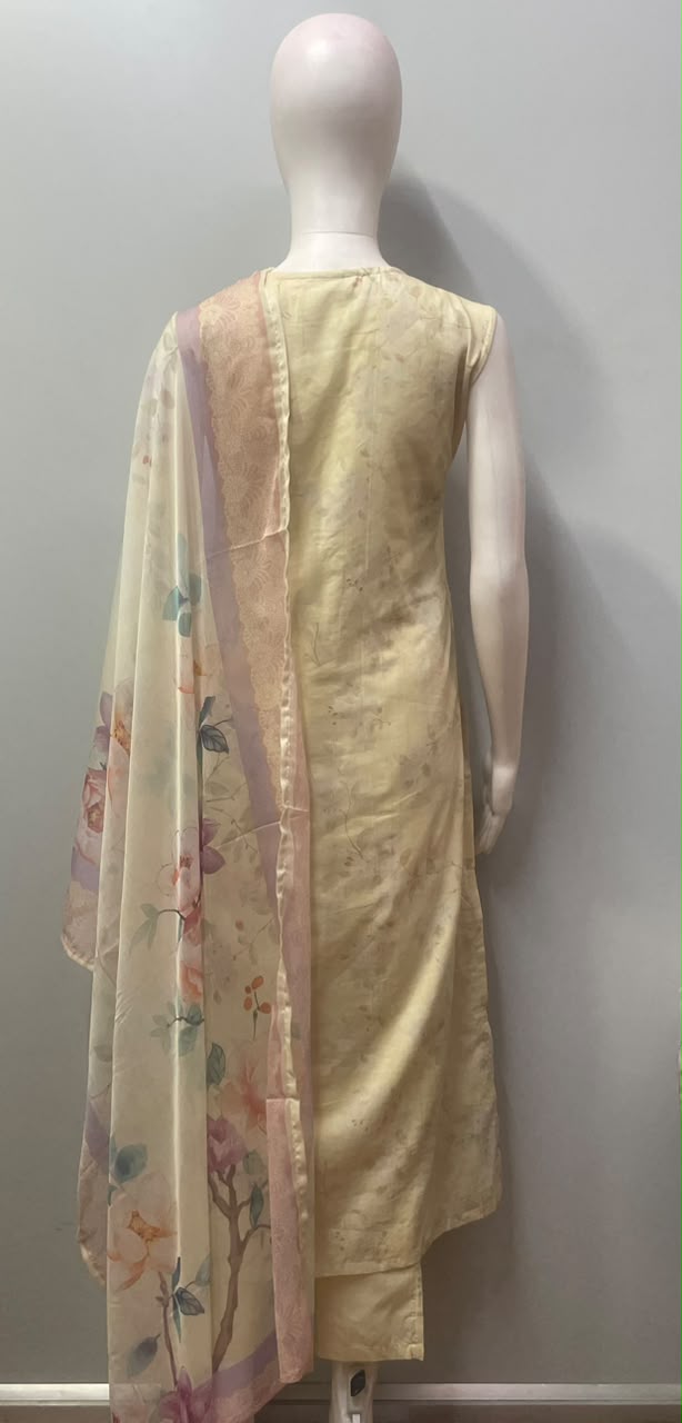 Lavender blossom embroidered ensemble photographed against a plain backdrop